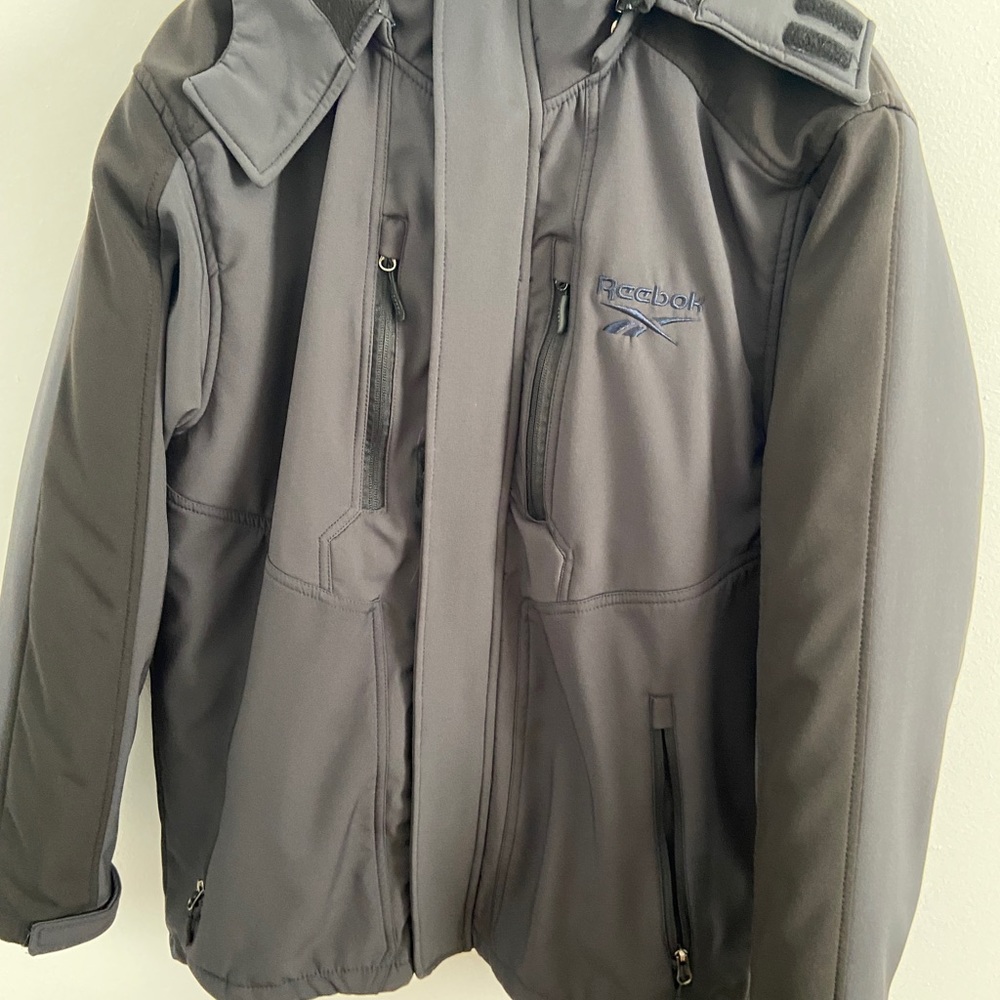 Boys 18-20/Men’s small black Reebok layered jacket new without tags